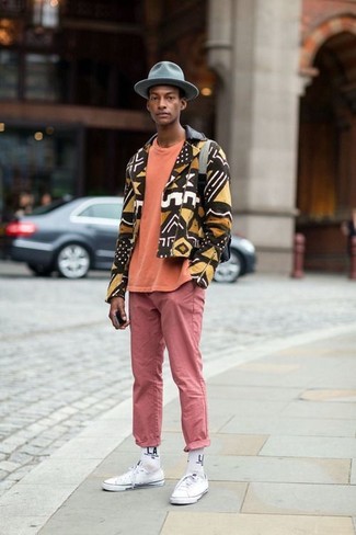 Men's Brown Print Biker Jacket, Orange Crew-neck T-shirt, Pink Chinos, White Canvas Low Top Sneakers