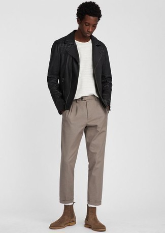 A black leather biker jacket and khaki chinos are wonderful menswear staples that will integrate well within your off-duty styling rotation. Finishing with brown suede chelsea boots is the most effective way to infuse a bit of elegance into your look.