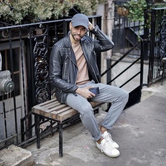 Light Blue Baseball Cap Outfits For Men: This pairing of a black leather biker jacket and a light blue baseball cap is hard proof that a safe off-duty outfit doesn't have to be boring. White canvas low top sneakers will inject a hint of polish into an otherwise everyday look.