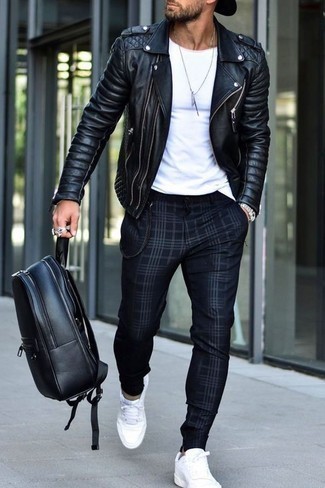 Black Biker Jacket Outfits For Men: The go-to for a neat casual look for men? A black biker jacket with navy plaid chinos. A pair of white canvas low top sneakers looks perfect here.