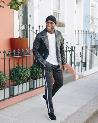 Black Biker Jacket Outfits For Men: This combination of a black biker jacket and charcoal chinos makes for the ultimate casual getup for any gent. A pair of black and white athletic shoes will bring a more dressed-down aesthetic to the look.