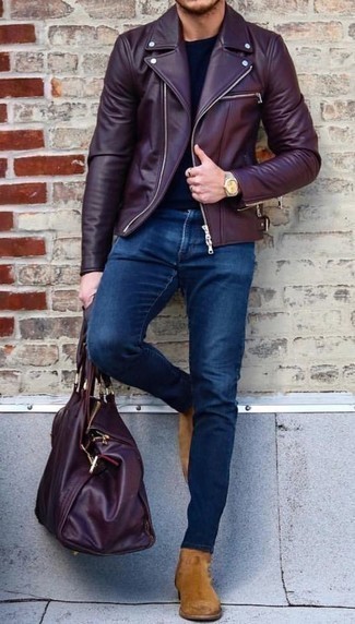 Burgundy Leather Duffle Bag Outfits For Men: Dress in a burgundy leather biker jacket and a burgundy leather duffle bag if you're after a look idea for when you want to look casual and cool. Ramp up the formality of this ensemble a bit by finishing off with tan suede chelsea boots.