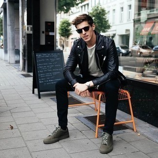 Dark Green Canvas Low Top Sneakers Outfits For Men: This pairing of a black leather biker jacket and black jeans is super easy to imitate and so comfortable to work as well! A pair of dark green canvas low top sneakers looks wonderful completing this look.