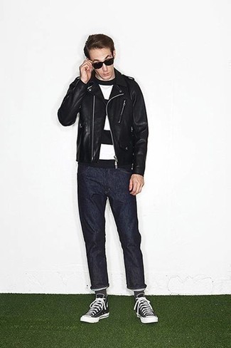 Black Canvas High Top Sneakers Outfits For Men: This combo of a black leather biker jacket and navy jeans is seriously stylish and yet it's casual enough and apt for anything. And if you need to effortlessly play down this look with one single piece, why not complement your look with a pair of black canvas high top sneakers?
