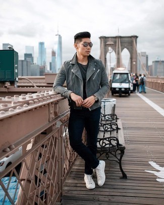 Charcoal Suede Biker Jacket Outfits For Men: A charcoal suede biker jacket and navy jeans are a great go-to combo to keep in your closet. Showcase your easy-going side by finishing off with white canvas high top sneakers.