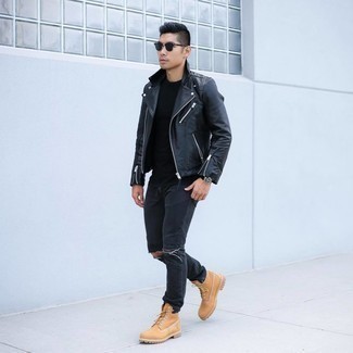Tan Leather Work Boots Outfits For Men: Show off your chops in men's fashion in this off-duty pairing of a black leather biker jacket and black ripped jeans. Introduce a pair of tan leather work boots to this outfit and ta-da: your look is complete.