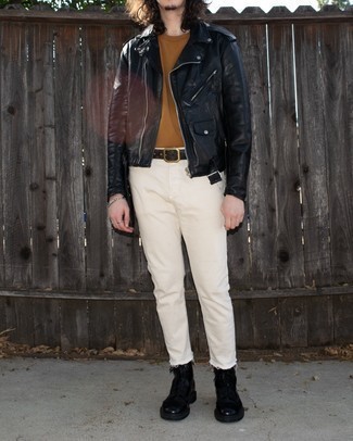 Why not wear a black leather biker jacket and beige jeans? Both of these items are super functional and look amazing paired together. To give your overall look a dressier aesthetic, complement your ensemble with black leather casual boots.