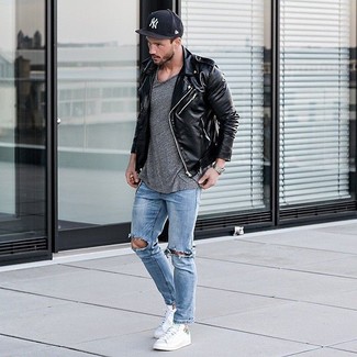 Light Blue Ripped Skinny Jeans Outfits For Men: For comfort dressing with an urban finish, you can dress in a black leather biker jacket and light blue ripped skinny jeans. Kick up this whole look by slipping into a pair of white plimsolls.