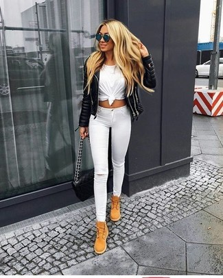 White Ripped Skinny Jeans Outfits: Choose a black quilted leather biker jacket and white ripped skinny jeans for both chic and easy-to-style getup. A pair of tan suede lace-up flat boots looks stunning here.
