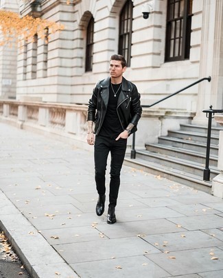 If you're a fan of relaxed dressing when it comes to your personal style, you'll love this bold casual combination of a black leather biker jacket and black skinny jeans. Black leather desert boots are an effective way to give an added touch of class to this outfit.