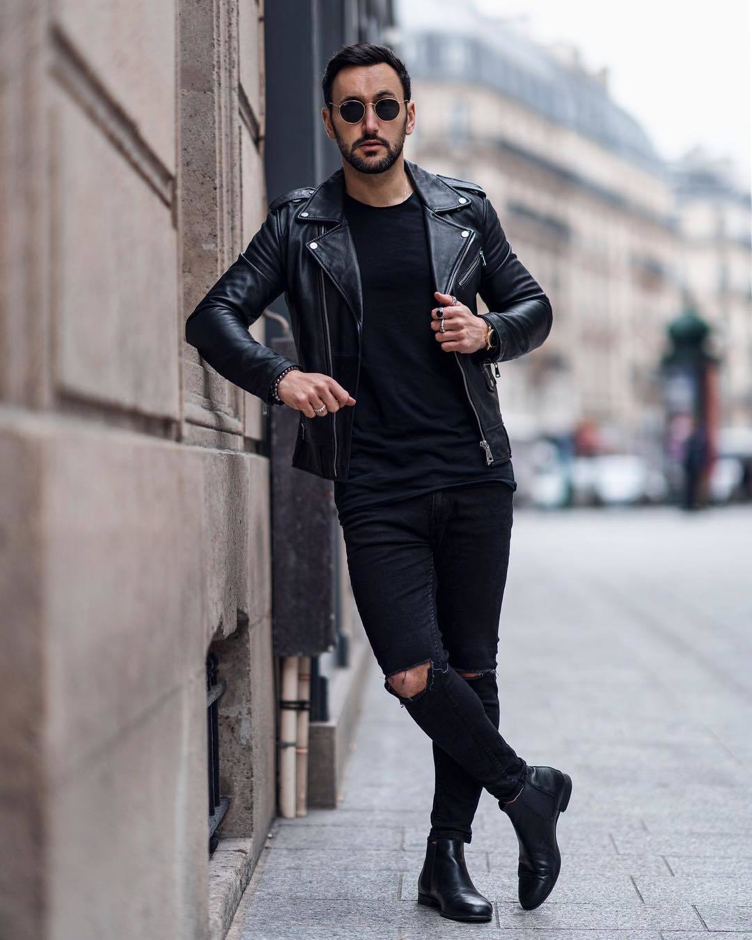 Young Handsome Guy In A White Tshirt Black Leather Jacket And Blue Torn  Jeans Is On The Street Model City Walk Live Style In White Sneakers Stock  Photo - Download Image Now -