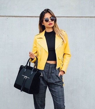Grey Tapered Pants Outfits For Women: Choose a yellow leather biker jacket and grey tapered pants for a standout outfit.