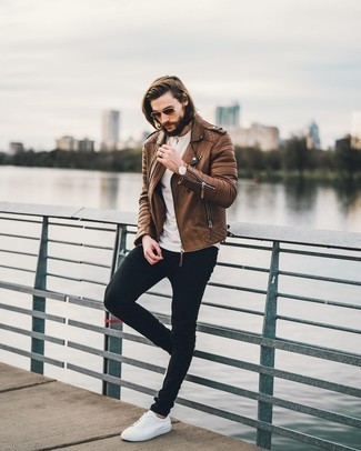 Brown Leather Biker Jacket Outfits For Men: Choose a brown leather biker jacket and black skinny jeans for a street style getup that's easy to wear. You can get a bit experimental with footwear and class up this outfit by rounding off with a pair of white canvas low top sneakers.