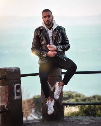 White and Navy Print Hoodie Outfits For Men: A white and navy print hoodie and black skinny jeans worn together are a sartorial dream for those who prefer casual combos. For something more on the classier end to finish this look, introduce white leather low top sneakers to the mix.