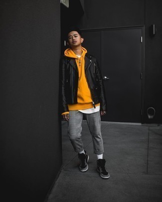 Orange Hoodie Outfits For Men: This pairing of an orange hoodie and grey plaid chinos will be a good exhibition of your skills in menswear styling even on weekend days. If you need to immediately play down this ensemble with shoes, add black print leather high top sneakers to the equation.