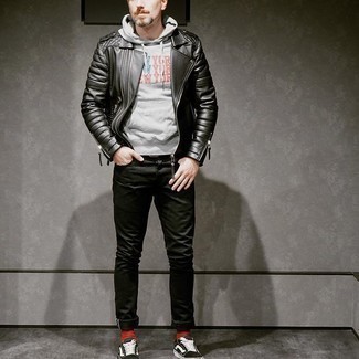 Red Socks Outfits For Men: This city casual combo of a black quilted leather biker jacket and red socks can only be described as seriously stylish. Give an extra touch of refinement to your outfit by rounding off with black and white canvas low top sneakers.