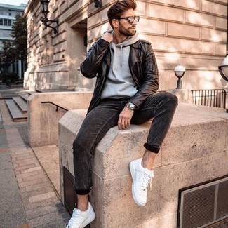 Black Biker Jacket Outfits For Men: For a casually stylish look, team a black biker jacket with charcoal jeans — these items fit really well together. Complete your look with white leather low top sneakers and ta-da: your ensemble is complete.