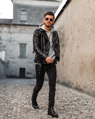 Grey Hoodie Outfits For Men: A grey hoodie and black skinny jeans are the perfect way to inject played down dapperness into your day-to-day routine. Black leather chelsea boots are a guaranteed way to bring an element of elegance to this ensemble.