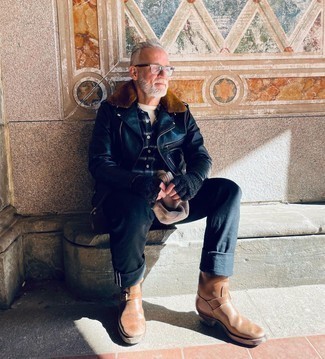Brown Leather Chelsea Boots with Black Jeans Outfits For Men: This combo of a black leather biker jacket and black jeans is an interesting balance between practical and dapper. Brown leather chelsea boots will give a hint of elegance to an otherwise straightforward getup.