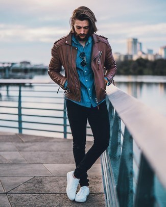 Men's Brown Leather Biker Jacket, Blue Chambray Long Sleeve Shirt, Black Skinny Jeans, White Canvas Low Top Sneakers