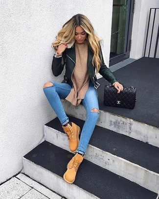 For a casual and cool look, team a black leather biker jacket with light blue ripped skinny jeans — these two pieces play beautifully together. If in doubt about the footwear, complement this look with tan suede lace-up flat boots.