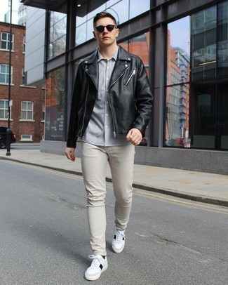 White and Black Leather Shoes with Pants Outfits For Men: When the situation allows off-duty styling, you can easily opt for a black leather biker jacket and pants. To introduce some extra definition to this look, add white and black leather low top sneakers to the mix.