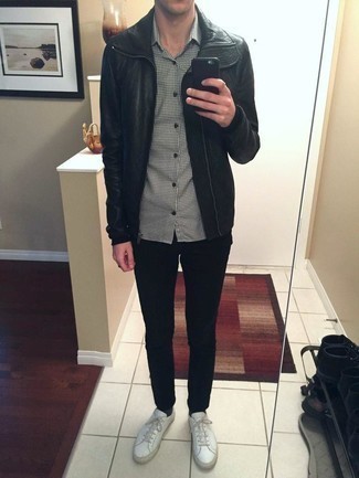 Black Jeans with Black Leather Biker Jacket Outfits For Men: Teaming a black leather biker jacket with black jeans is a wonderful idea for an off-duty ensemble. Complete your ensemble with white leather low top sneakers and you're all done and looking dashing.