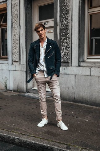 White Tank Outfits For Men: Such items as a white tank and beige jeans are an easy way to inject subtle dapperness into your day-to-day repertoire. Puzzled as to how to finish your ensemble? Wear white canvas low top sneakers to bump it up a notch.