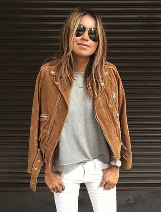 White Jeans Outfits For Women: Nail off-duty look by wearing a brown suede biker jacket and white jeans.