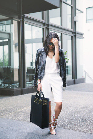White Leather Gladiator Sandals Outfits: Why not rock a black leather biker jacket with white shorts? Both pieces are super comfortable and will look fabulous paired together. Take a more laid-back approach with footwear and complete this ensemble with white leather gladiator sandals.