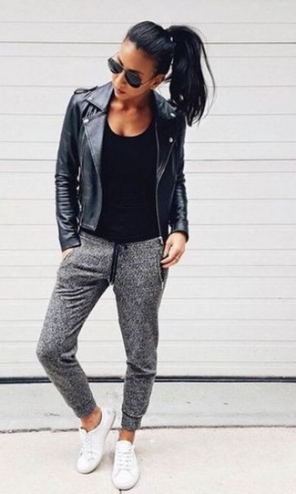 Black Tank Outfits For Women: A black tank and grey sweatpants are a great pairing to have in your wardrobe. Add a glam twist to an otherwise mostly casual look by rounding off with a pair of white leather low top sneakers.