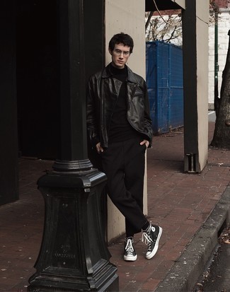 Leather Jacket Outfits For Men: You'll be surprised at how extremely easy it is for any man to throw together this casual getup. Just a leather jacket combined with black chinos. To give your overall outfit a more relaxed spin, introduce a pair of black and white canvas high top sneakers to the equation.