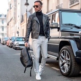 Grey Vertical Striped Chinos Outfits: A black leather biker jacket and grey vertical striped chinos are the kind of a no-brainer off-duty outfit that you need when you have no time. Look at how well this ensemble pairs with a pair of white canvas low top sneakers.