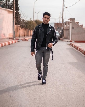 Black Studded Leather Biker Jacket Outfits For Men: Marrying a black studded leather biker jacket with charcoal jeans is an amazing option for a cool and casual ensemble. Black canvas low top sneakers integrate really well within a multitude of outfits.