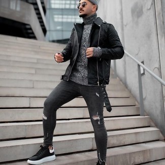 Black Biker Jacket Outfits For Men: Dress in a black biker jacket and charcoal ripped skinny jeans if you want to look casually dapper without too much effort. Complement your look with black and white leather low top sneakers to make the look slightly more polished.