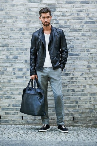 Black and White Leather Tote Bag Outfits For Men: This combo of a black leather biker jacket and a black and white leather tote bag sends off a laid-back and effortless vibe. Want to go all out in the shoe department? Complete your ensemble with a pair of black and white leather low top sneakers.