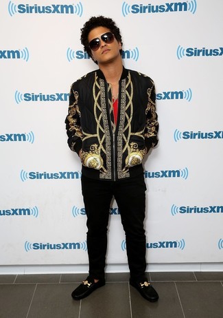 Bruno Mars wearing Black and Gold Print Bomber Jacket, Red Tank, Black Chinos, Black Suede Driving Shoes