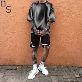 Black Sports Shorts Outfits For Men: To pull together a laid-back getup with an edgy twist, choose a black and white horizontal striped crew-neck t-shirt and black sports shorts. A pair of white athletic shoes acts as the glue that brings this outfit together.