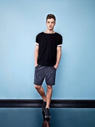 Black and White Crew-neck T-shirt Outfits For Men: This combo of a black and white crew-neck t-shirt and charcoal shorts is an exciting pick for when it's time to clock off. Want to tone it down when it comes to footwear? Introduce black athletic shoes to your outfit for the day.