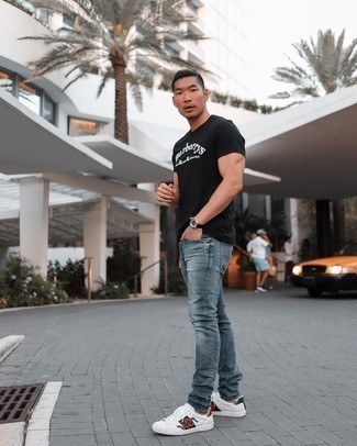 Grey Jeans Outfits For Men: This casual combination of a black and white print crew-neck t-shirt and grey jeans is simple, stylish and very easy to imitate. For maximum fashion effect, introduce white print leather low top sneakers to the mix.