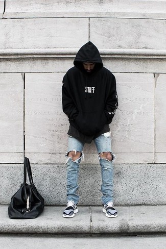 Black and White Hoodie Outfits For Men: This pairing of a black and white hoodie and light blue ripped skinny jeans is the perfect foundation for a laid-back and cool getup. A pair of grey athletic shoes will pull your whole ensemble together.
