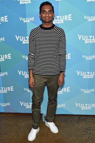 Aziz Ansari wearing Black and White Horizontal Striped Crew-neck Sweater, Olive Chinos, White Leather Low Top Sneakers