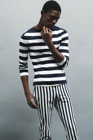 To don an off-duty look with a twist, you can opt for a black and white horizontal striped long sleeve t-shirt and black and white vertical striped chinos.