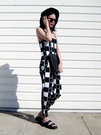 Busy off-duty days require a straightforward yet totaly chic look, such as a black and white plaid jumpsuit. Clueless about how to round off? Complement your ensemble with a pair of black leather flat sandals for a more casual touch.