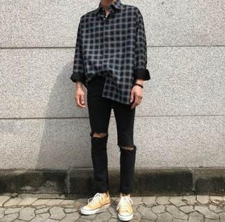Yellow Canvas Low Top Sneakers Outfits For Men: Showcase that you do casual like no-one else in a black and white check flannel long sleeve shirt and black ripped jeans. Inject an added dose of style into this outfit with yellow canvas low top sneakers.