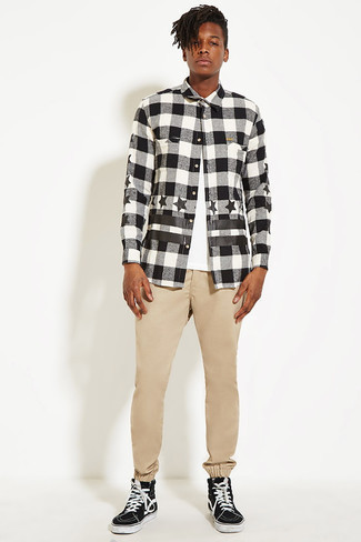 Black and White Check Flannel Long Sleeve Shirt Outfits For Men: Inject versatility into your day-to-day off-duty repertoire with a black and white check flannel long sleeve shirt and khaki chinos. Black and white canvas high top sneakers are an effective way to bring a hint of stylish effortlessness to this outfit.