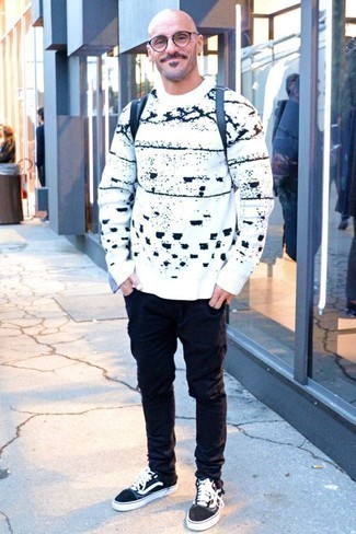 Men's Black Backpack, Black and White Low Top Sneakers, Black Ripped Jeans, White and Black Print Crew-neck Sweater
