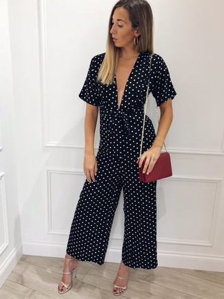 Red Leather Crossbody Bag Outfits: Why not consider wearing a black and white polka dot jumpsuit and a red leather crossbody bag? Both of these pieces are totally practical and will look fabulous worn together. Feeling venturesome? Elevate this look by slipping into silver leather heeled sandals.