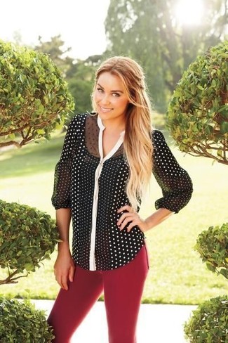 Burgundy Skinny Jeans Outfits: In situations comfort is the priority, this pairing of a black and white polka dot long sleeve blouse and burgundy skinny jeans is a no-brainer.