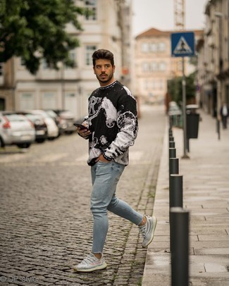 Black and White Print Crew-neck Sweater Outfits For Men: A black and white print crew-neck sweater and light blue skinny jeans paired together are a perfect match. Complement your look with a pair of grey athletic shoes to make the ensemble more functional.